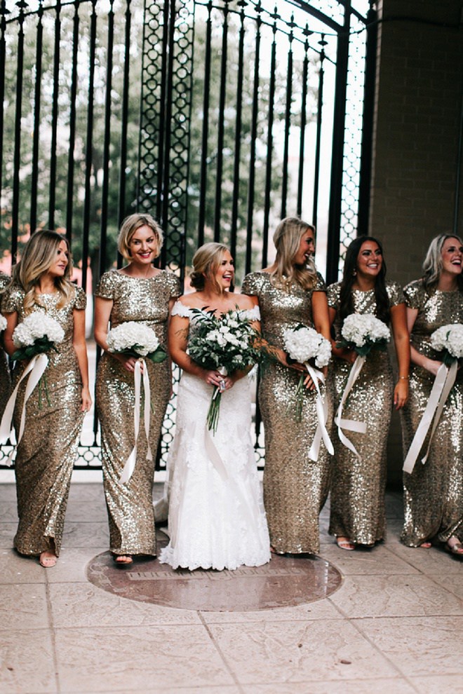 We LOVE these super fun gold and glittery bridesmaid's dresses!