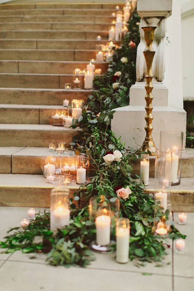Candles and greenery are the perfect combination for a holiday wedding.