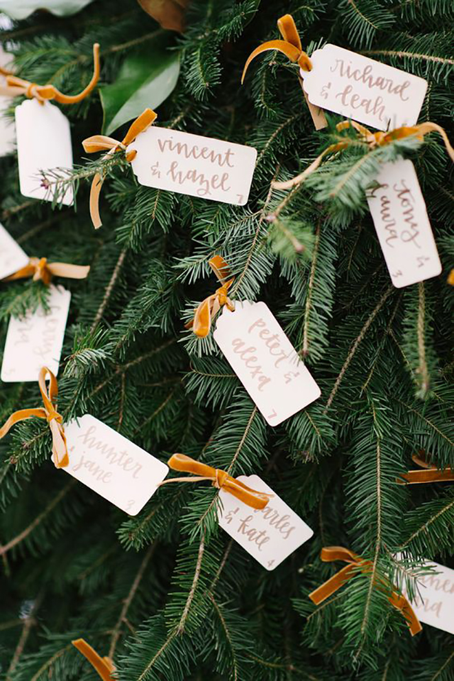 Escort cards tied to garlands or trees is a magical idea!
