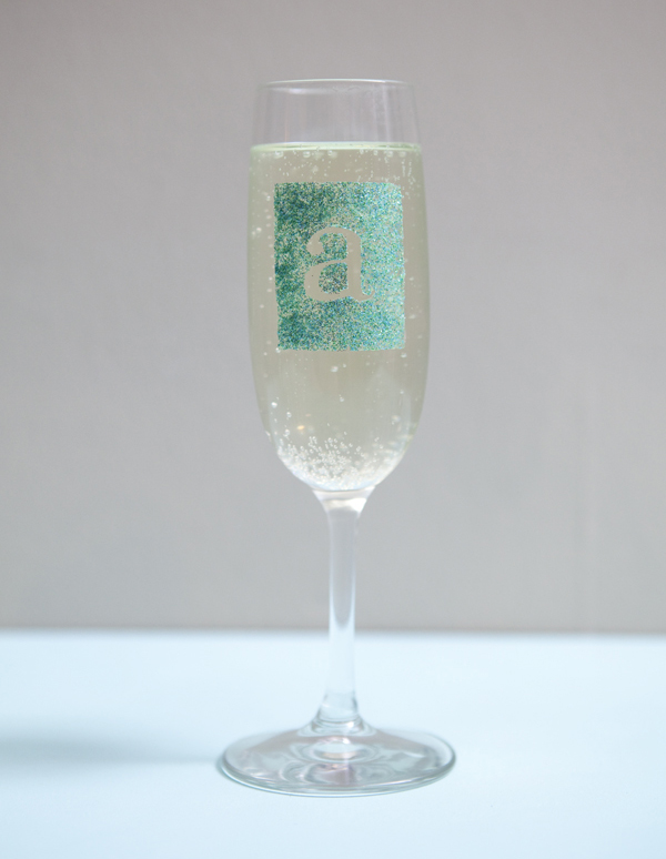 glam glitter champagne glass DIY by SomethingTurquoise.com