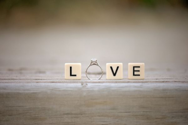 Love, wedding ring shot with scrabble tiles