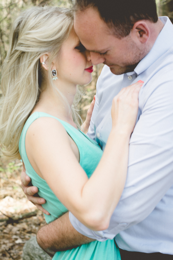 Engagement embrace... in a turquoise dress!