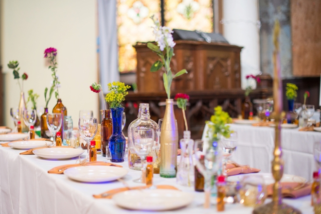 Beautiful DIY boho wedding decor... glass bottles and wildflowers!