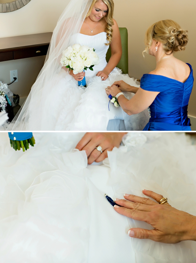Super sweet 'something blue' pinned into the brides dress