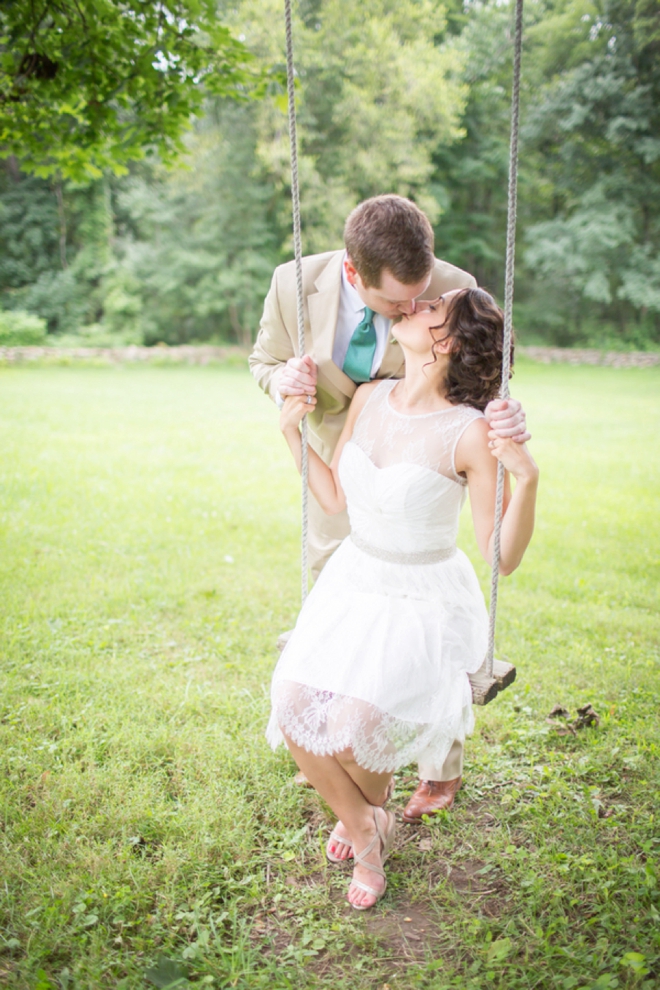 Bride and groom on a swing.