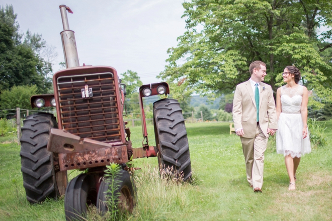 Bride and groom walking by tractor