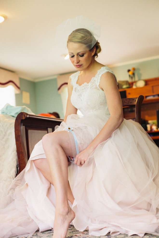 Bride putting on garter
