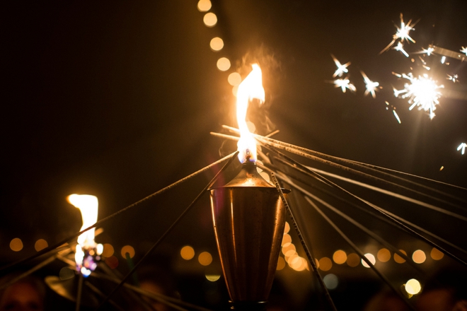 Sparklers being lit by a torch