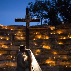 Bride and Groom in front of cross