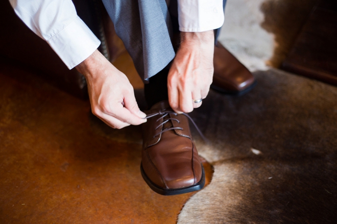 Groom tying shoe