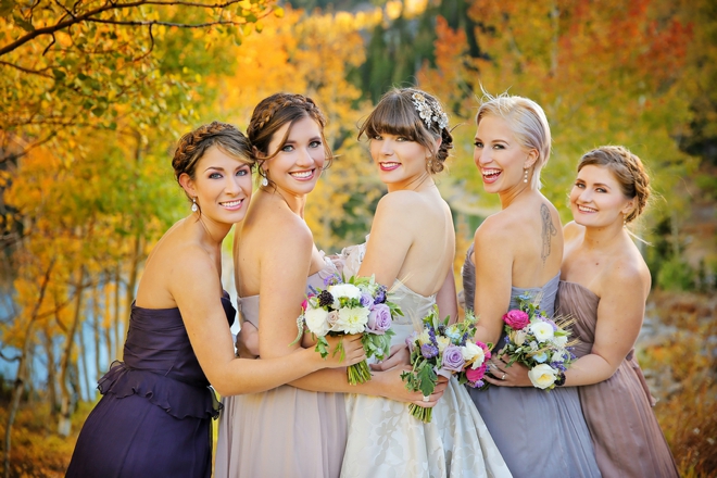 Lovely fall bridesmaids, wearing different purple shades
