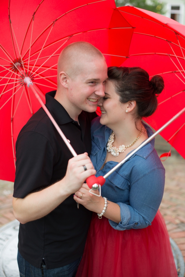 Red heart umbrellas in engagement