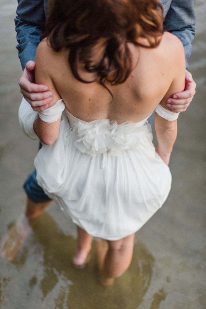 Bride and Groom wading the a lake