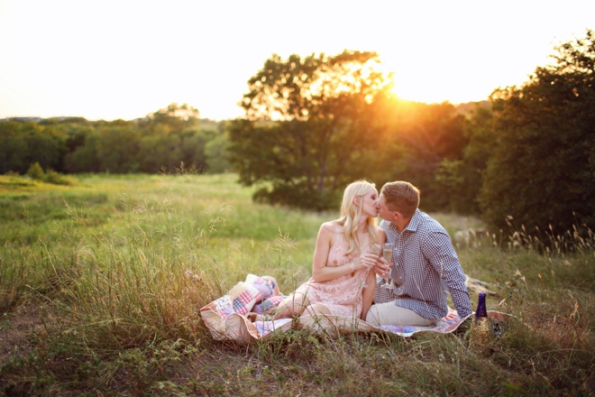 Beautiful engagement in a field at sunset