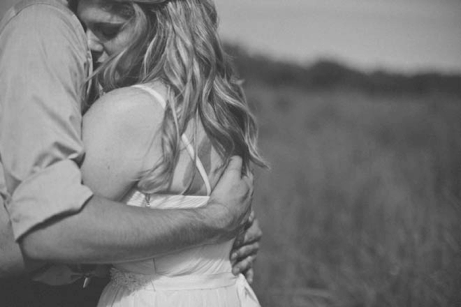 Bride and groom embrace