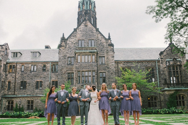 Gorgeous bride and groom portrait with bridal party