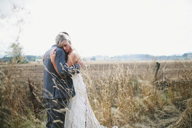 Bride and groom in a field