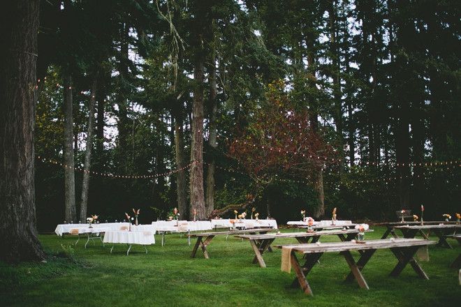Rustic outdoor reception with wooden tables