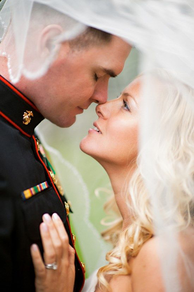 Bride looking up at her Marine.