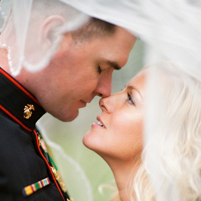 Bride looking up at her Marine.