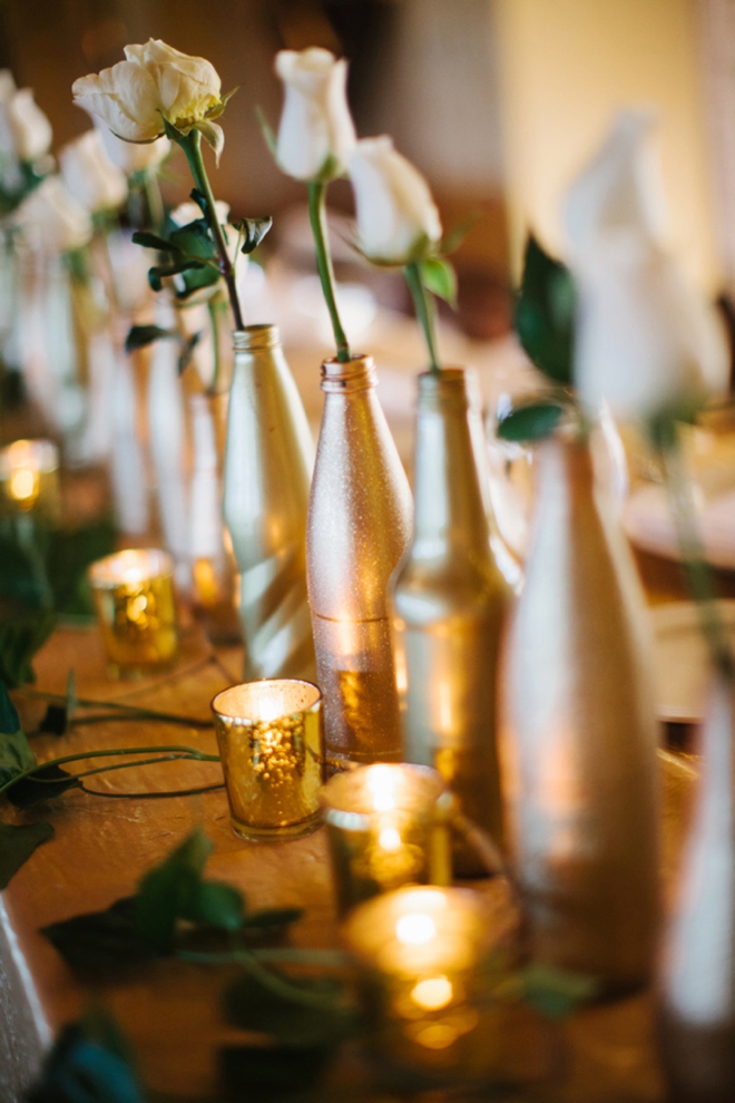 Gorgeous gold bottles on the head table