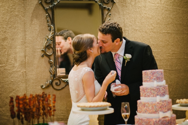 Cutting the sprinkle wedding cake