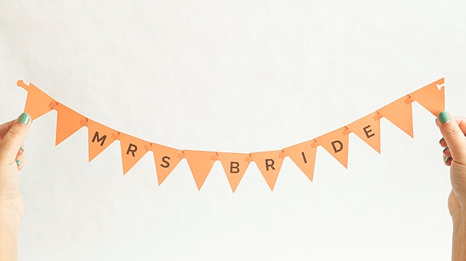 Adorable, DIY bunting flag banner for your wedding reception chairs!