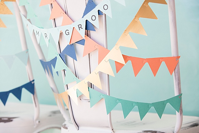 Adorable, DIY bunting flag banner for your wedding reception chairs!