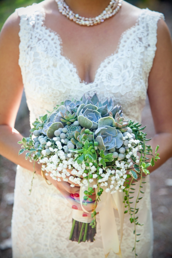 Stunning succulent wedding bouquet with long ribbons