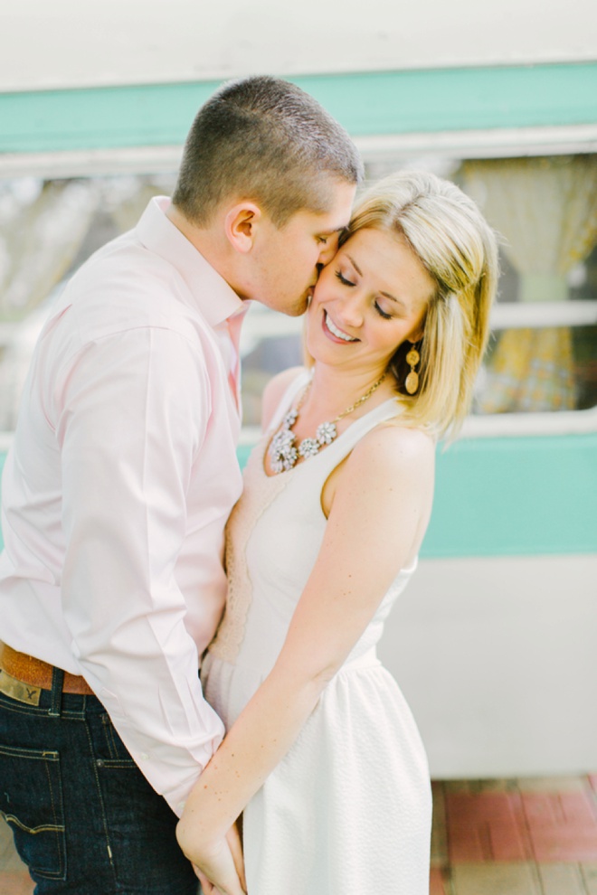 Adorable engagement with a vintage turquoise polka dot camper!