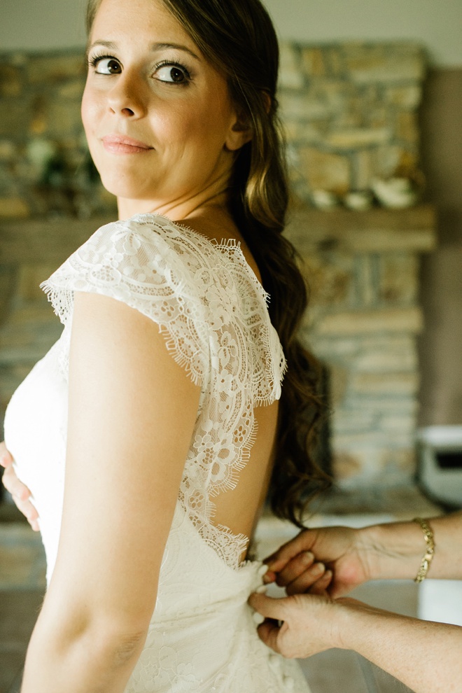 Stunning bride getting dressed