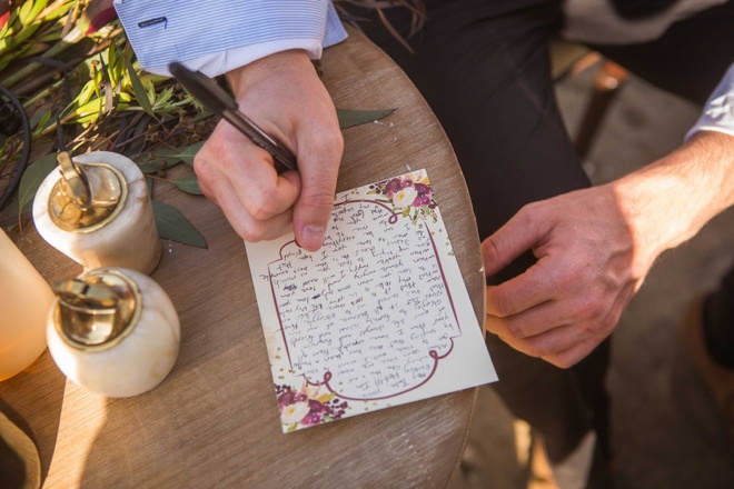 Groom writing a note to his bride