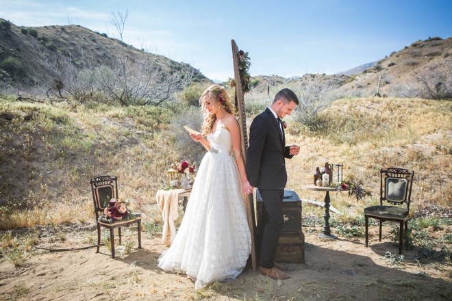 Bride and groom reading letters they wrote to each other!