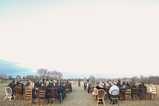 Stunning outdoor ceremony with random wooden chairs!