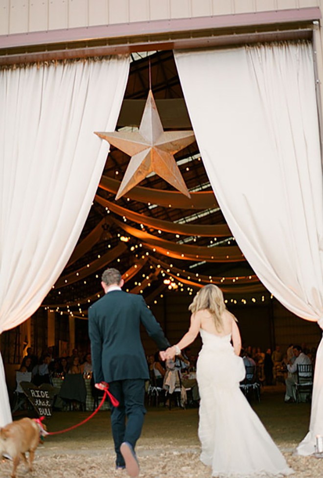 Barn drapes and a giant metal star, perfect for a Texas wedding!