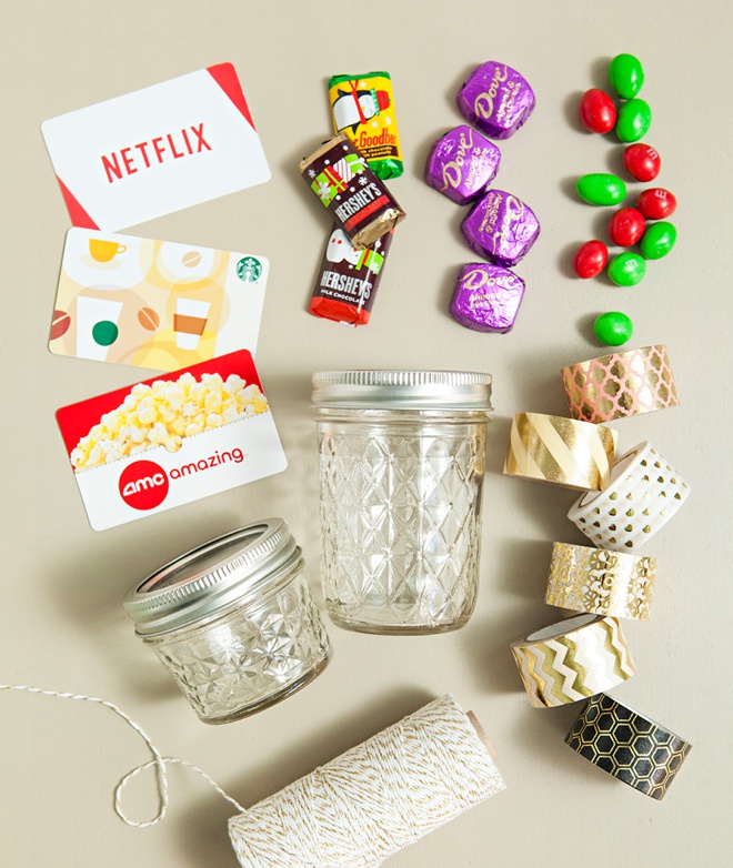 Glue two mason jar lids together to make the most darling gift card and candy holder!