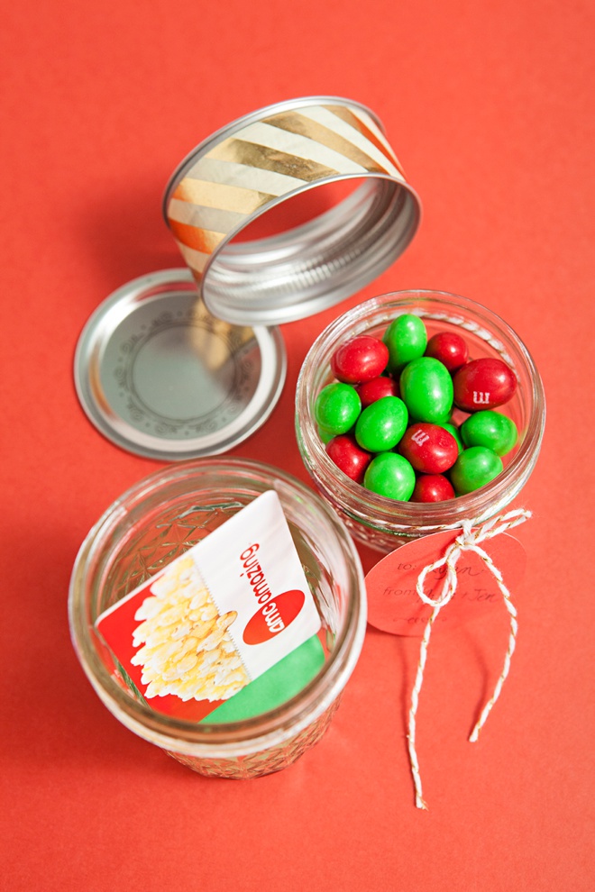 Glue two mason jar lids together to make the most darling gift card and candy holder!