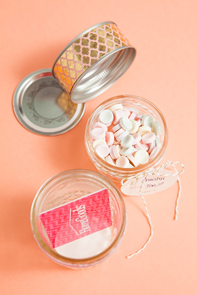 Glue two mason jar lids together to make the most darling gift card and candy holder!