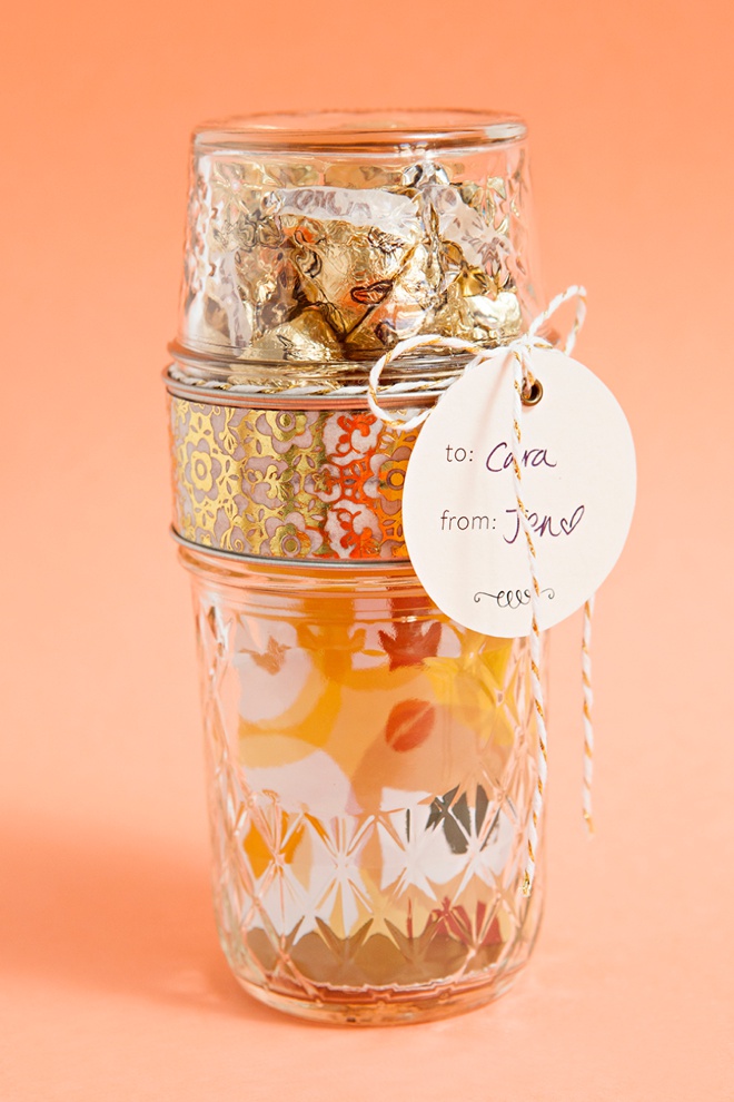 Glue two mason jar lids together to make the most darling gift card and candy holder!