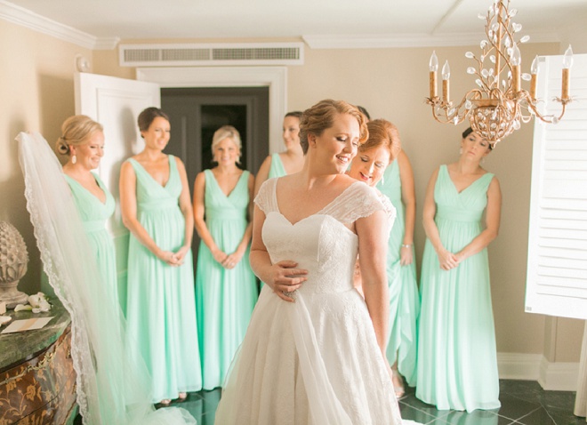 We love this shot of this gorgeous bride getting ready with her bridesmaids.