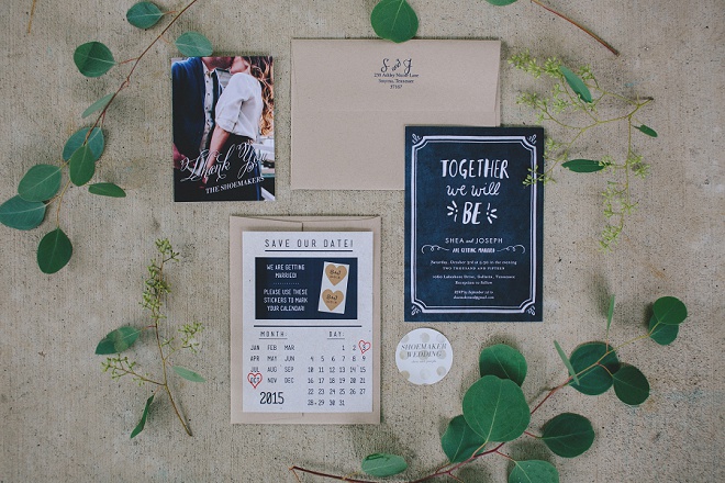 We love this neutral and navy wedding invite set framed in dreamy euclyptus!