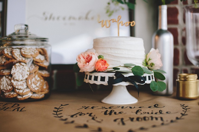 Love this gorgeous cut cake with wooden cake topper and cookie bar!