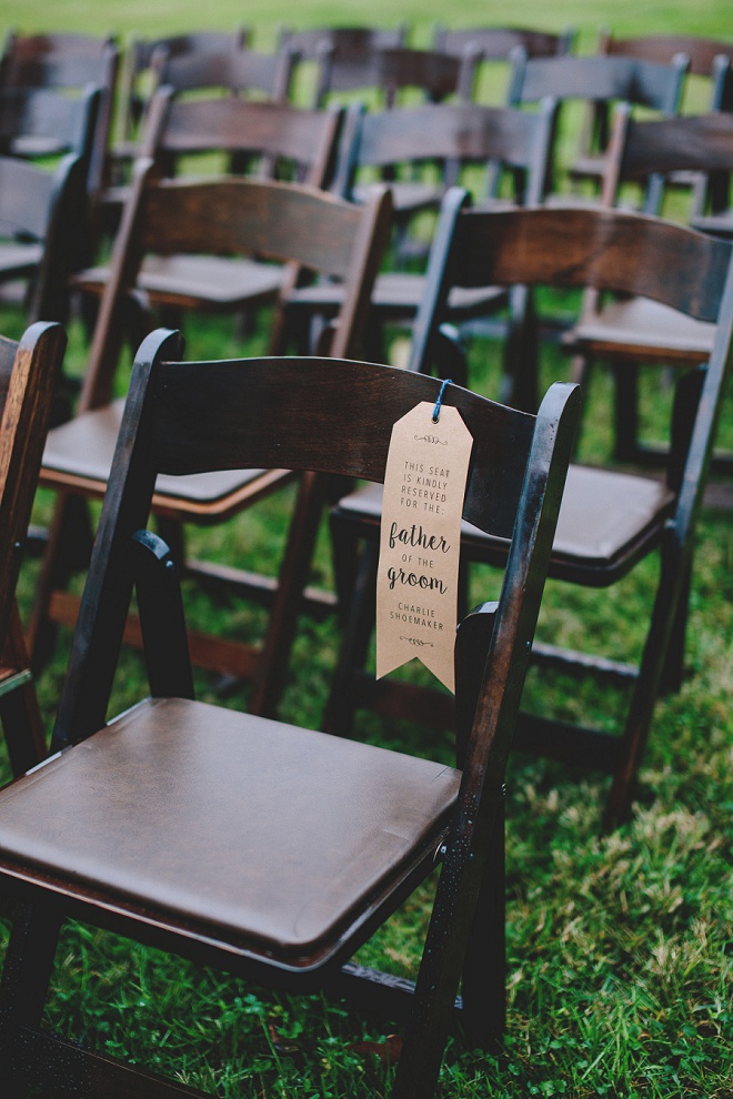 We're loving these DIY family chair tags at this gorgeous front porch wedding ceremony!