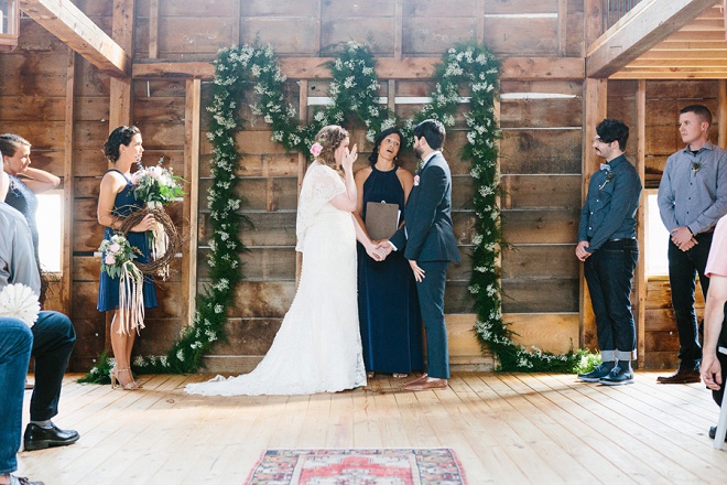 How darling is this highschool sweetheart's gorgeous wedding ceremony! We're loving the garland!