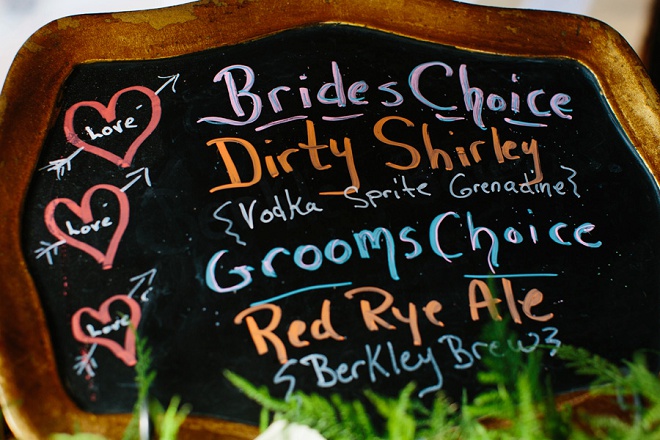 Loving this handpainted chalkboard drink menu at this fun DIY wedding!