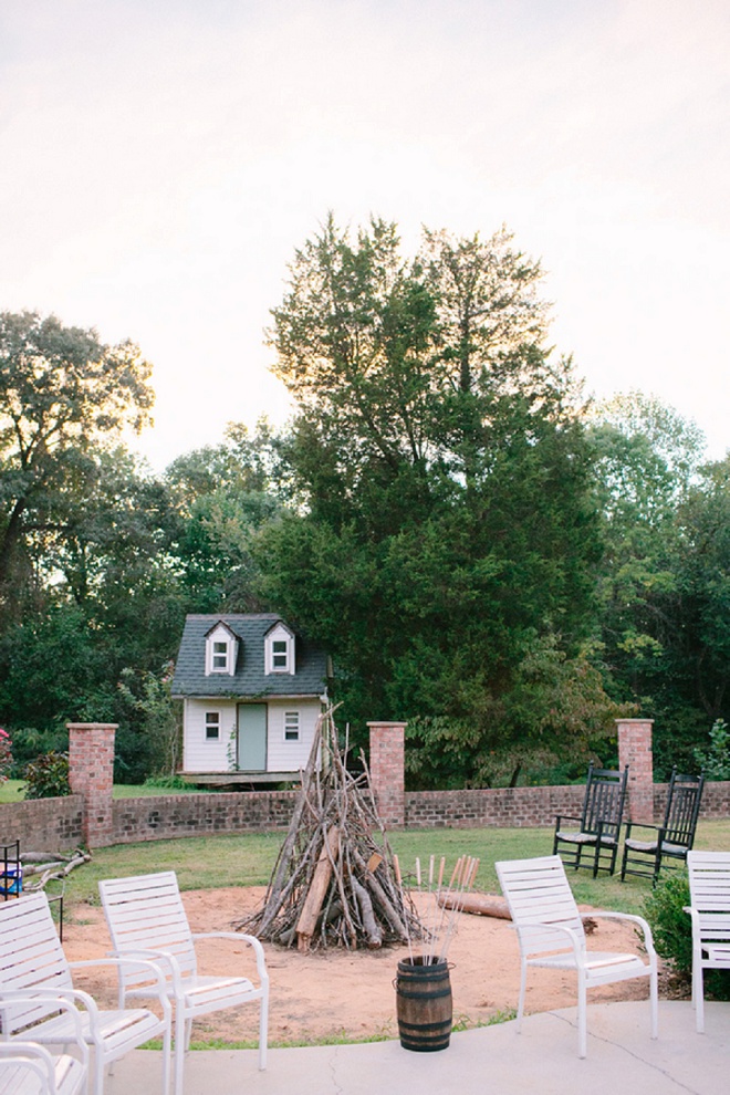 How fun is this firepit at this boho backyard wedding!