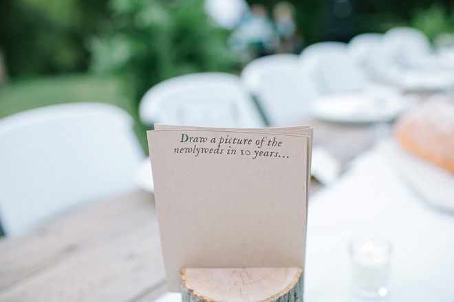 We love these fun question cards for guests at this backyard wedding!
