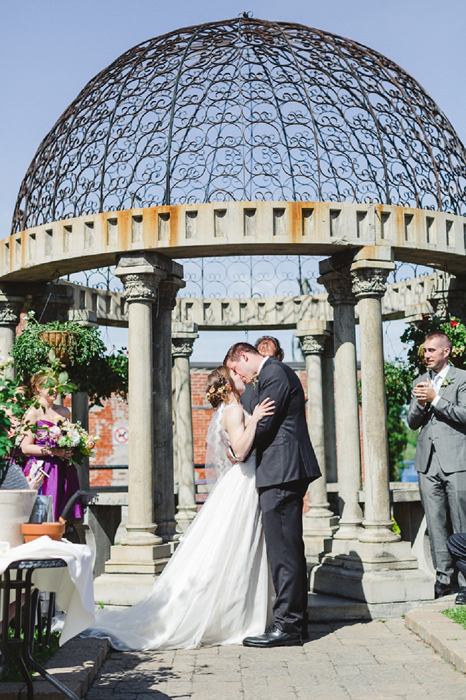 Darling first kiss at this beautiful outdoor ceremony!