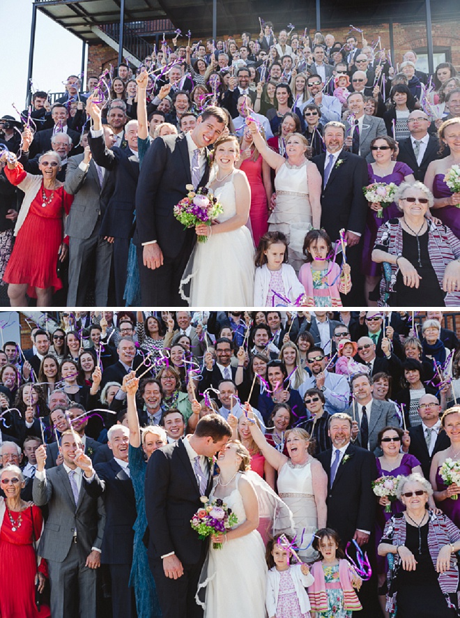 How FUN is this wedding photo with all of their guests?! Love it!