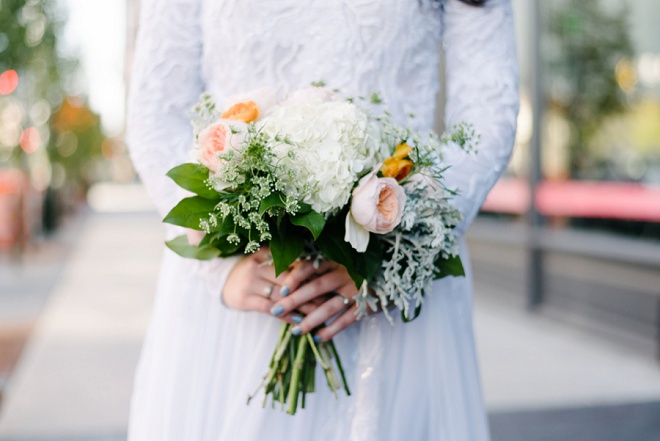 We're loving this bride's garden rose bouquet and vintage long sleeve dress!